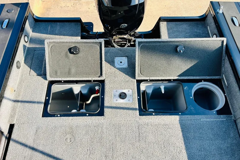 Slide: The Image of 2018 Tracker Targa V-19 Combo boat interior with open storage compartments. - 45