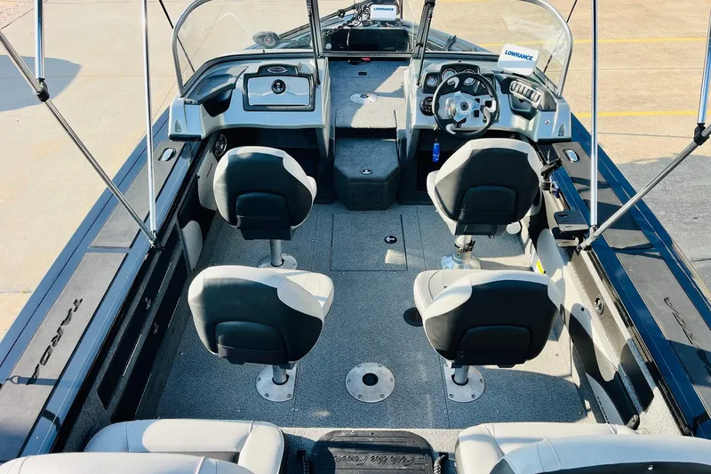 Slide: The Image of 2018 Tracker Targa V-19 Combo 40th Anniversary Edition boat interior with seating and steering console. - 9