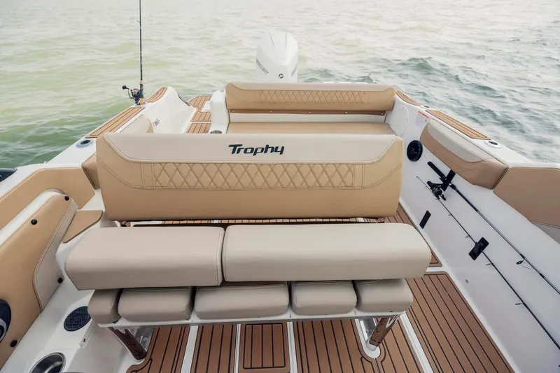 Slide: The Image of Manufacturer Provided Image: 2025 Bayliner Trophy T22SC boat interior with tan seating and wood-style flooring. - 4