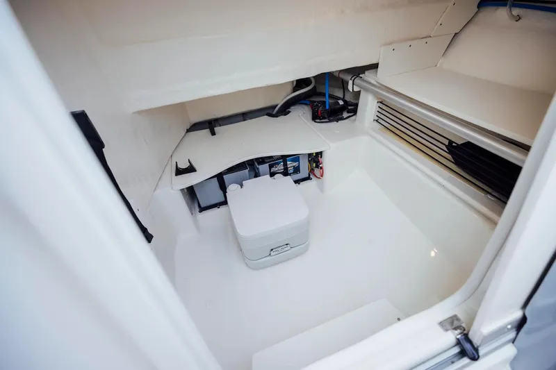 Slide: The Image of Manufacturer Provided Image: Interior of 2025 Bayliner Trophy T22SC boat, featuring storage and equipment space. - 5