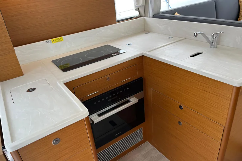 Slide: The Image of Modern kitchen in 2026 Beneteau 41 Swift Trawler Sedan with stove, sink, and oven. - 20