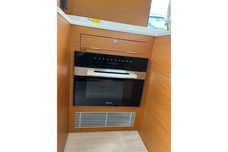 Slide: The Image of Modern kitchen appliance in 2026 Beneteau 41 Swift Trawler Sedan yacht interior. - 21
