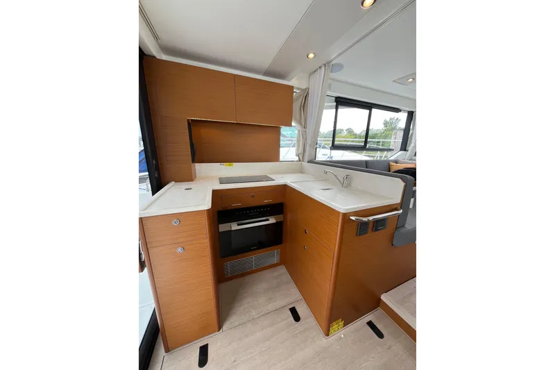 Slide: The Image of Modern kitchen in 2026 Beneteau 41 Swift Trawler Sedan with sleek cabinetry and appliances. - 22