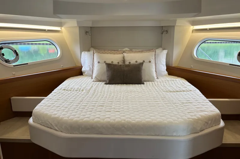 Slide: The Image of Luxurious bedroom interior of 2026 Beneteau 41 Swift Trawler Sedan with elegant bedding. - 25