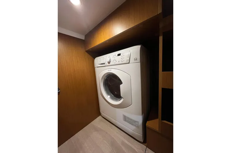 Slide: The Image of Laundry area with washing machine in 2026 Beneteau 41 Swift Trawler Sedan. - 35