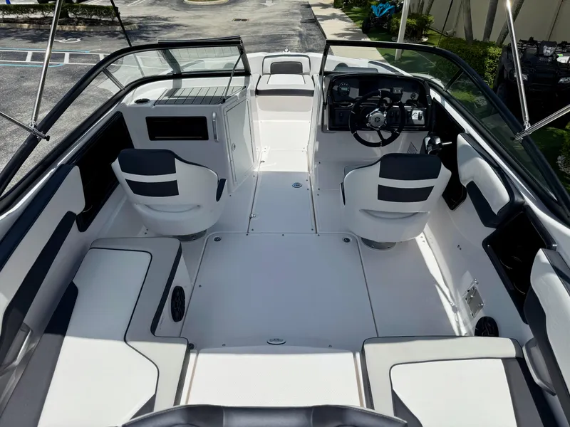 Slide: The Image of 2025 Yamaha Boats SX195 interior with sleek seating and modern dashboard design. - 4