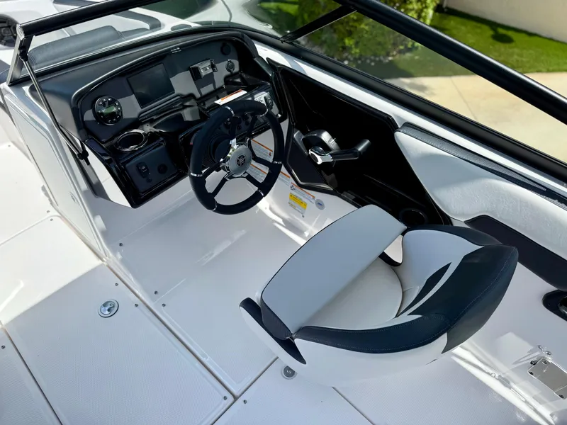 Slide: The Image of 2025 Yamaha Boats SX195 cockpit with modern steering and controls. - 6