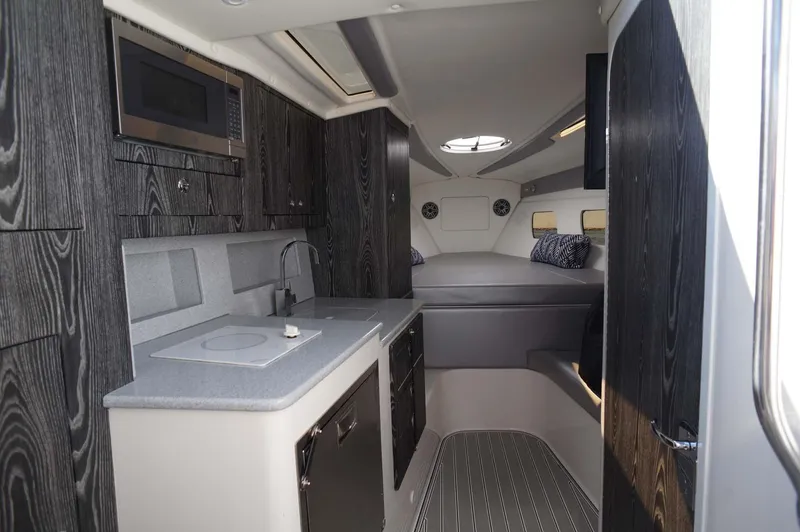 Slide: The Image of 2020 Concept 44' Cuddy Cabin interior with modern kitchen and cozy sleeping area. - 17