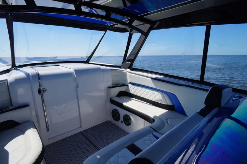 Slide: The Image of 2020 Concept 44' Cuddy Cabin interior with ocean view, featuring sleek seating and modern design. - 18