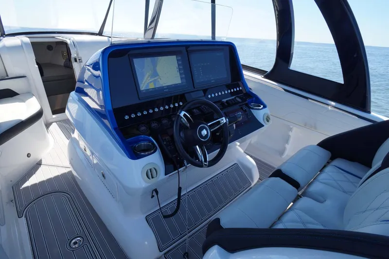 Slide: The Image of Helm of 2020 Concept 44' Cuddy Cabin boat with dual screens and luxury seating. - 30