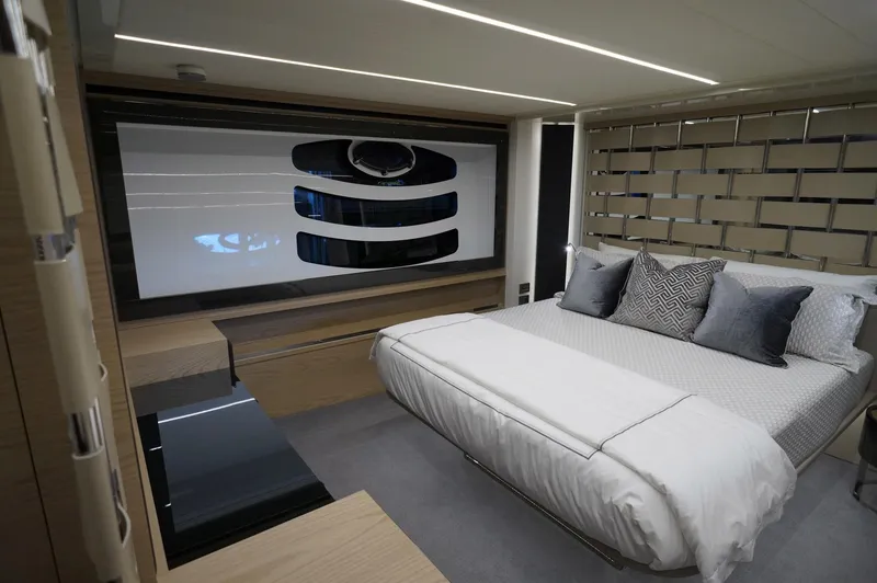 Slide: The Image of Luxurious bedroom interior of a 2016 Pershing 70 yacht with modern design elements. - 10