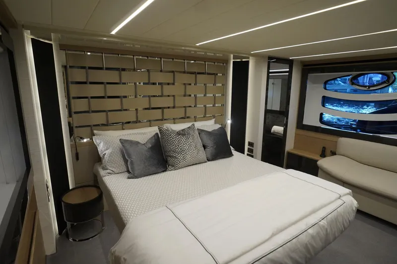 Slide: The Image of Luxurious bedroom interior of 2016 Pershing 70 yacht with modern design and elegant decor. - 11