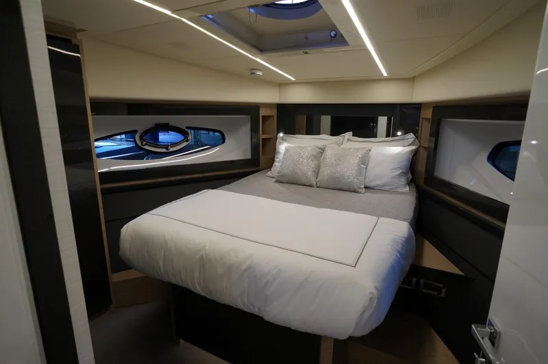 Slide: The Image of Luxurious bedroom interior of a 2016 Pershing 70 yacht with modern design. - 16
