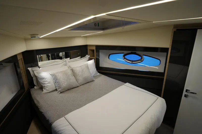 Slide: The Image of Luxurious bedroom interior of 2016 Pershing 70 yacht with modern design and elegant bedding. - 17