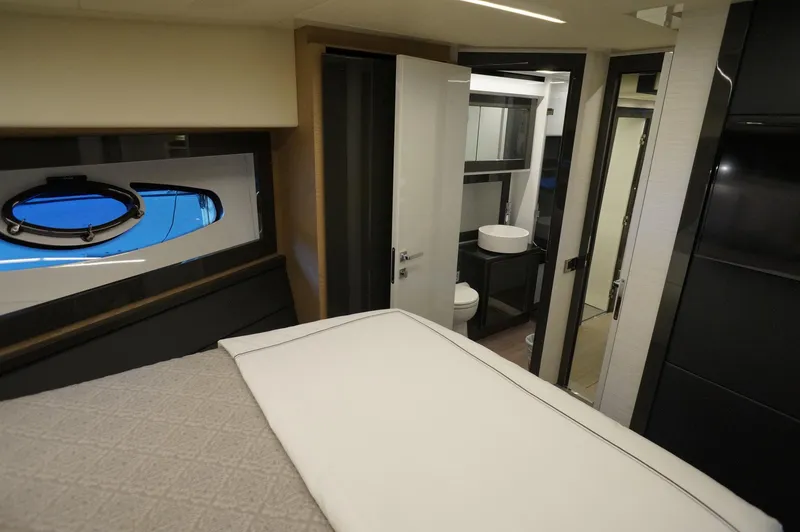Slide: The Image of Luxurious interior of a 2016 Pershing 70 yacht cabin with modern bathroom. - 18