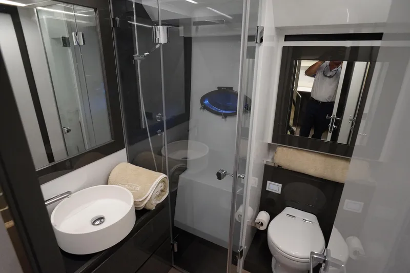 Slide: The Image of Luxurious bathroom in a 2016 Pershing 70 yacht with modern fixtures and elegant design. - 20