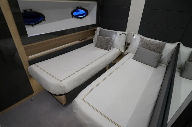 Slide: The Image of Interior of 2016 Pershing 70 yacht with twin beds and modern decor. - 22