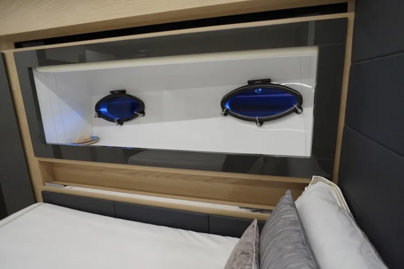 Slide: The Image of Interior cabin of 2016 Pershing 70 yacht with modern design and porthole windows. - 23