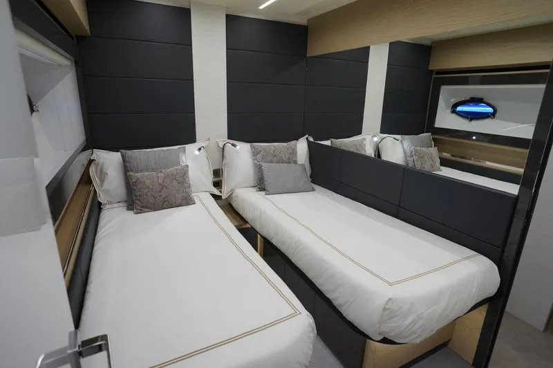 Slide: The Image of Luxurious twin bedroom in 2016 Pershing 70 yacht with modern decor and plush bedding. - 24