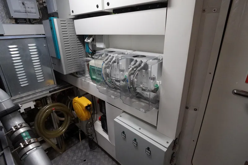 Slide: The Image of Engine room of 2016 Pershing 70 yacht, showcasing advanced machinery and equipment. - 36