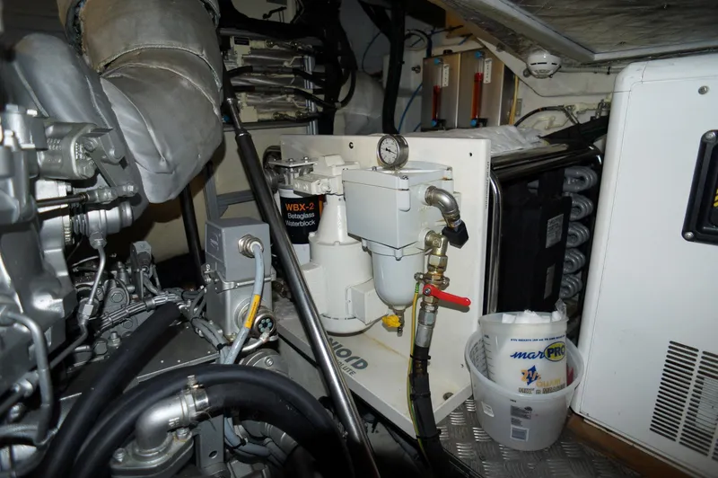 Slide: The Image of Engine room of 2016 Pershing 70 yacht with mechanical components and equipment. - 44