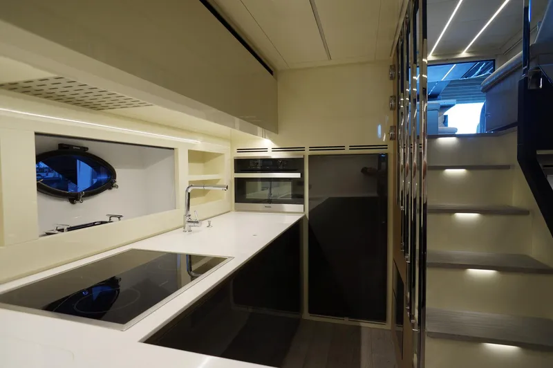 Slide: The Image of Modern kitchen interior of 2016 Pershing 70 yacht with sleek design and appliances. - 9