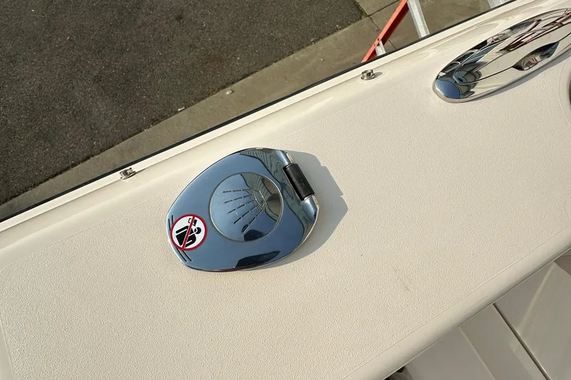 Slide: The Image of Chrome boat cleat on 2017 Grady White 235 deck, with no-step warning sticker. - 12