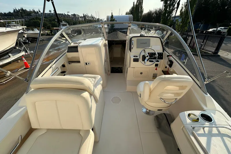 Slide: The Image of 2017 Grady White 235 boat interior with helm, seating, and controls. - 13