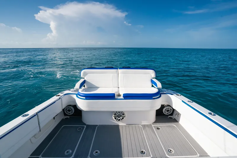 Slide: The Image of 2022 Nor-Tech 392 Super Fish boat on open ocean, featuring spacious seating. - 23