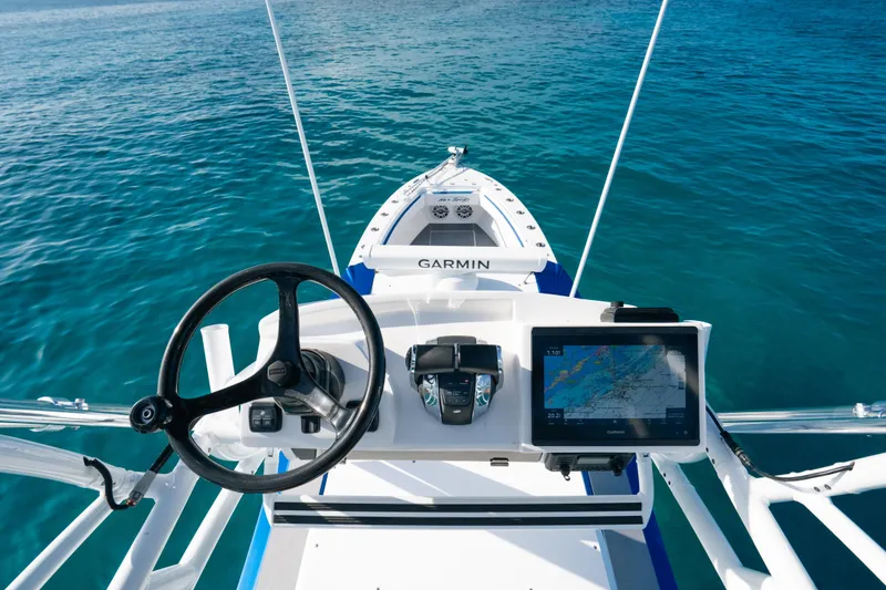 Slide: The Image of Cockpit view of 2022 Nor-Tech 392 Super Fish boat with Garmin navigation system. - 27