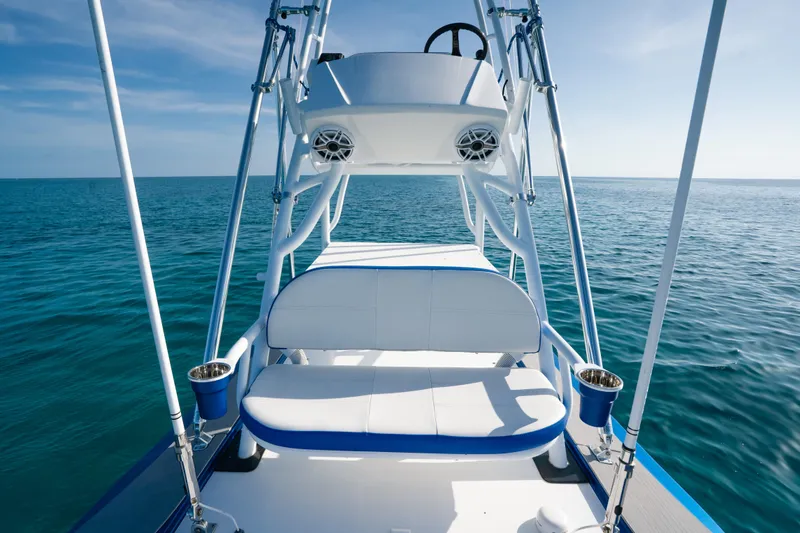 Slide: The Image of 2022 Nor-Tech 392 Super Fish boat on open sea, featuring sleek design and comfortable seating. - 30