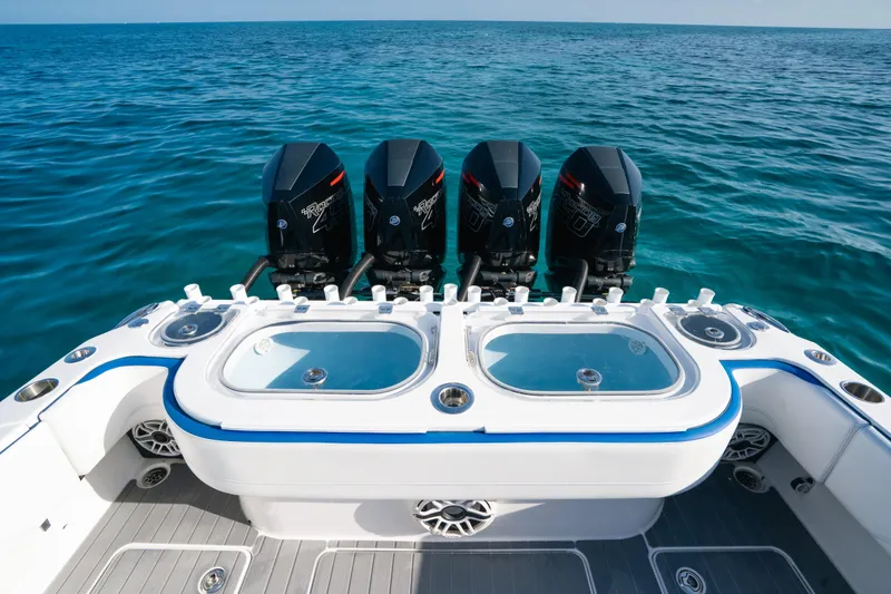 Slide: The Image of 2022 Nor-Tech 392 Super Fish boat with four powerful outboard engines on open sea. - 33