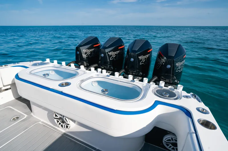 Slide: The Image of 2022 Nor-Tech 392 Super Fish boat with quad engines and live wells on open water. - 35