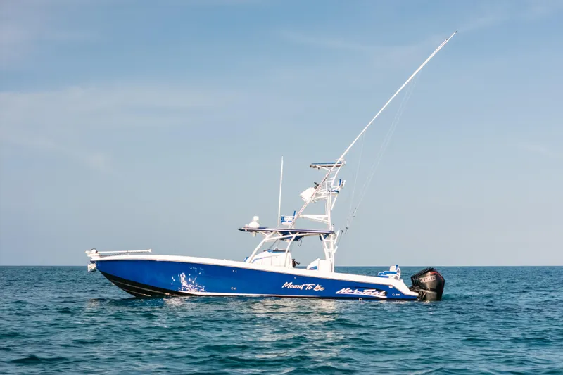 Slide: The Image of 2022 Nor-Tech 392 Super Fish boat on calm ocean waters under clear sky. - 38