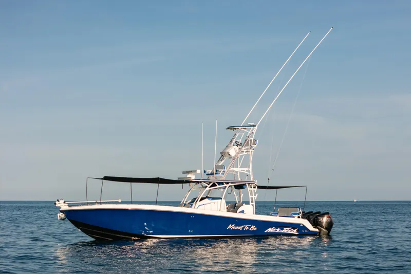 Slide: The Image of 2022 Nor-Tech 392 Super Fish boat on calm ocean waters under clear sky. - 50