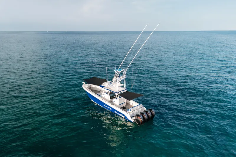 Slide: The Image of 2022 Nor-Tech 392 Super Fish boat on open sea, featuring dual antennas. - 51