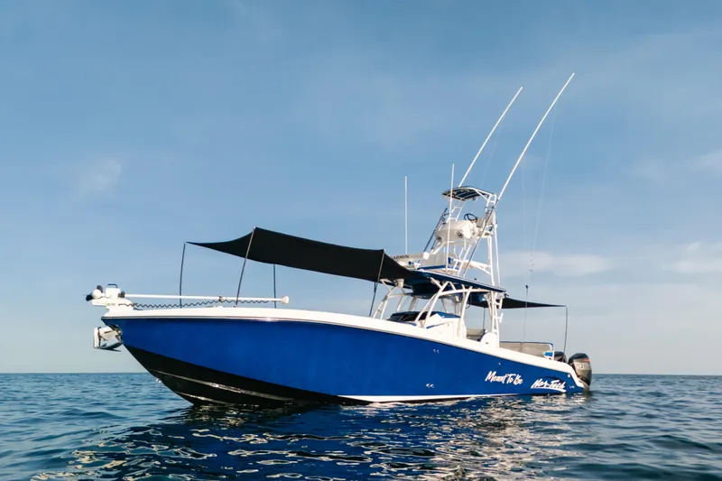 Slide: The Image of 2022 Nor-Tech 392 Super Fish boat on calm ocean waters under clear sky. - 6