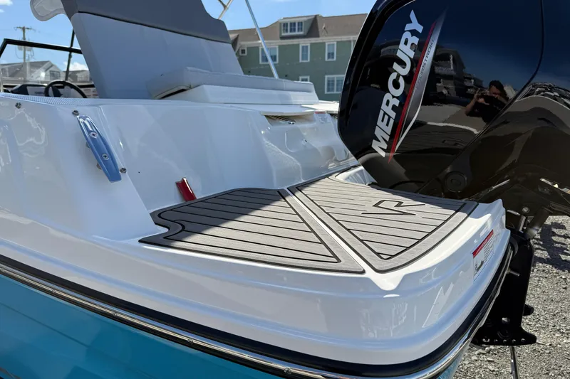 Slide: The Image of 2025 Bayliner VR4 Bowrider OB with Mercury outboard engine, rear deck view. - 4