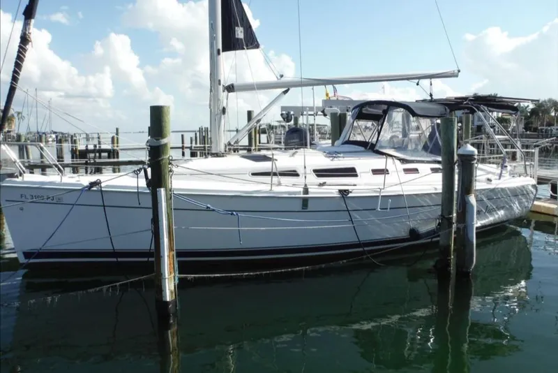 Slide: The Image of 2009 Hunter 38 sailboat on stands in a boatyard, ready for maintenance. - 1