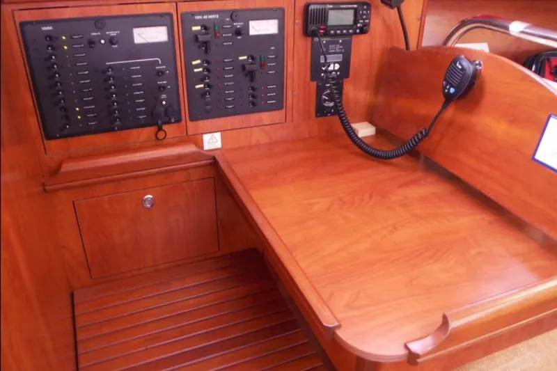 Slide: The Image of 2009 Hunter 38 sailboat docked at marina during sunset. - 11