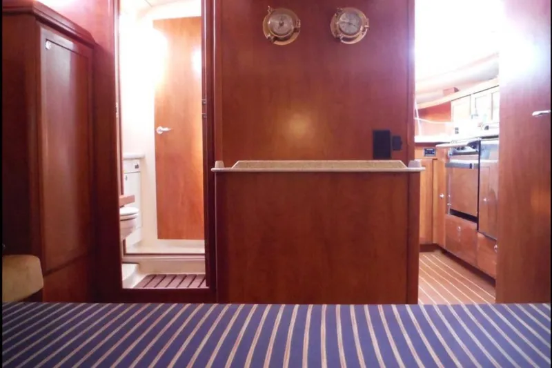 Slide: The Image of Galley kitchen in 2009 Hunter 38 sailboat with stove and kettle. - 15