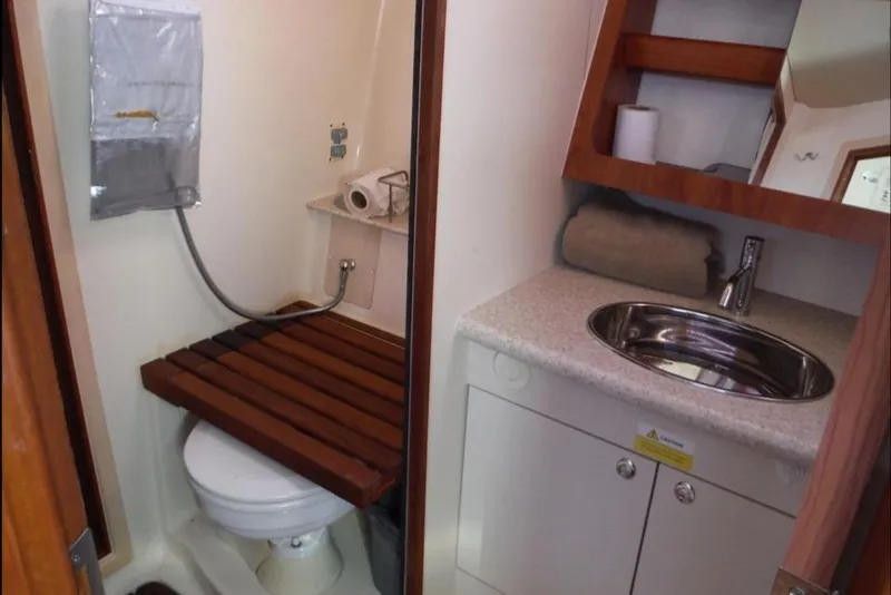 Slide: The Image of 2009 Hunter 38 yacht interior with navigation station and cozy seating area. - 16