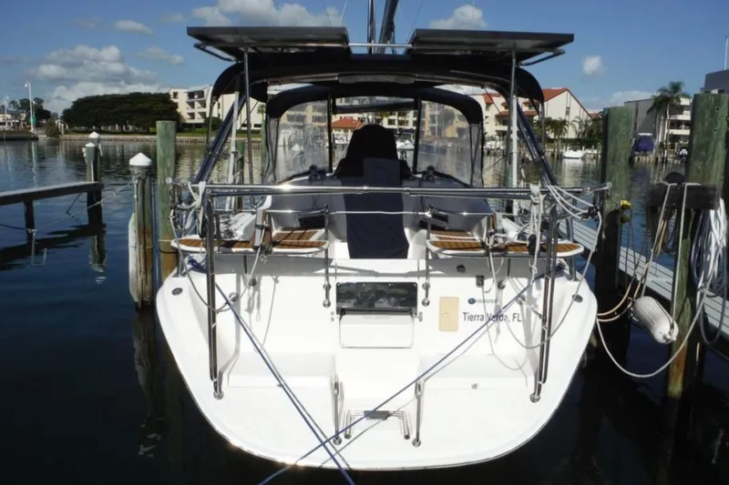 Slide: The Image of 2009 Hunter 38 sailboat hull on stands, showcasing keel and red bottom paint. - 2
