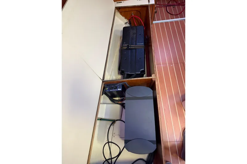 Slide: The Image of Control panel of a 2009 Hunter 38 sailboat with various switches and voltmeter. - 27