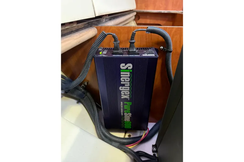 Slide: The Image of Hunter 38 sailboat with Lifesling rescue system and dinghy at marina, sunset view. - 29