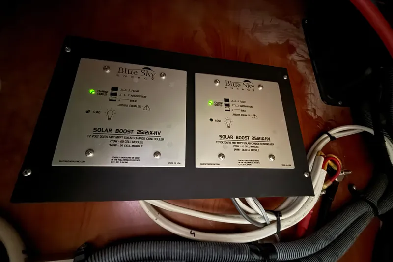 Slide: The Image of Engine compartment of a 2009 Hunter 38 sailboat, showing hoses and fittings. - 30