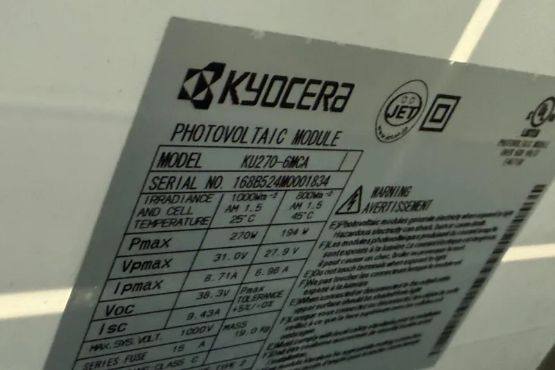 Slide: The Image of Kyocera photovoltaic module label with specifications and warnings, model XU270-6MCA. - 35