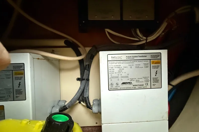 Slide: The Image of Electrical components inside a 2009 Hunter 38, featuring a ProMariner ProSafe Isolation Transformer. - 36