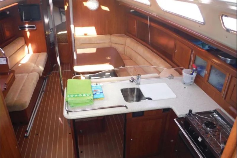 Slide: The Image of Sailboat with solar panels docked at marina, Hunter 38 model, 2009. - 9