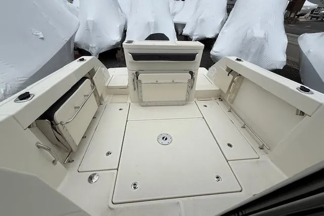 Slide: The Image of 2025 Bayliner Trophy T23 Pilothouse boat deck with storage compartments. - 22